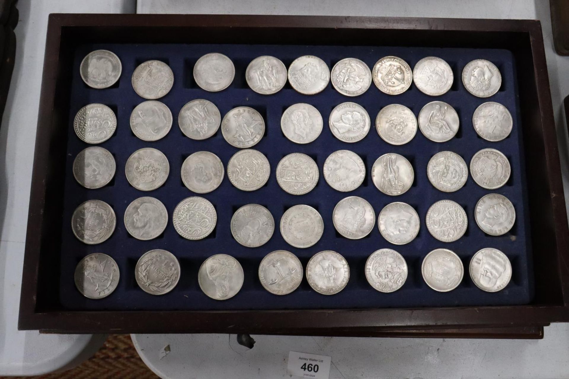 FORTY FOUR VARIOUS VINTAGE TOKENS/COINS IN A WOODEN BOX