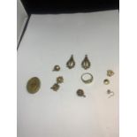 A QUANTITY OF YELLOW METAL ITEMS TO INCLUDE RINGS, EARRINGS ETC