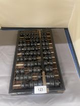 A VINTAGE WOOD AND BRASS ABACUS