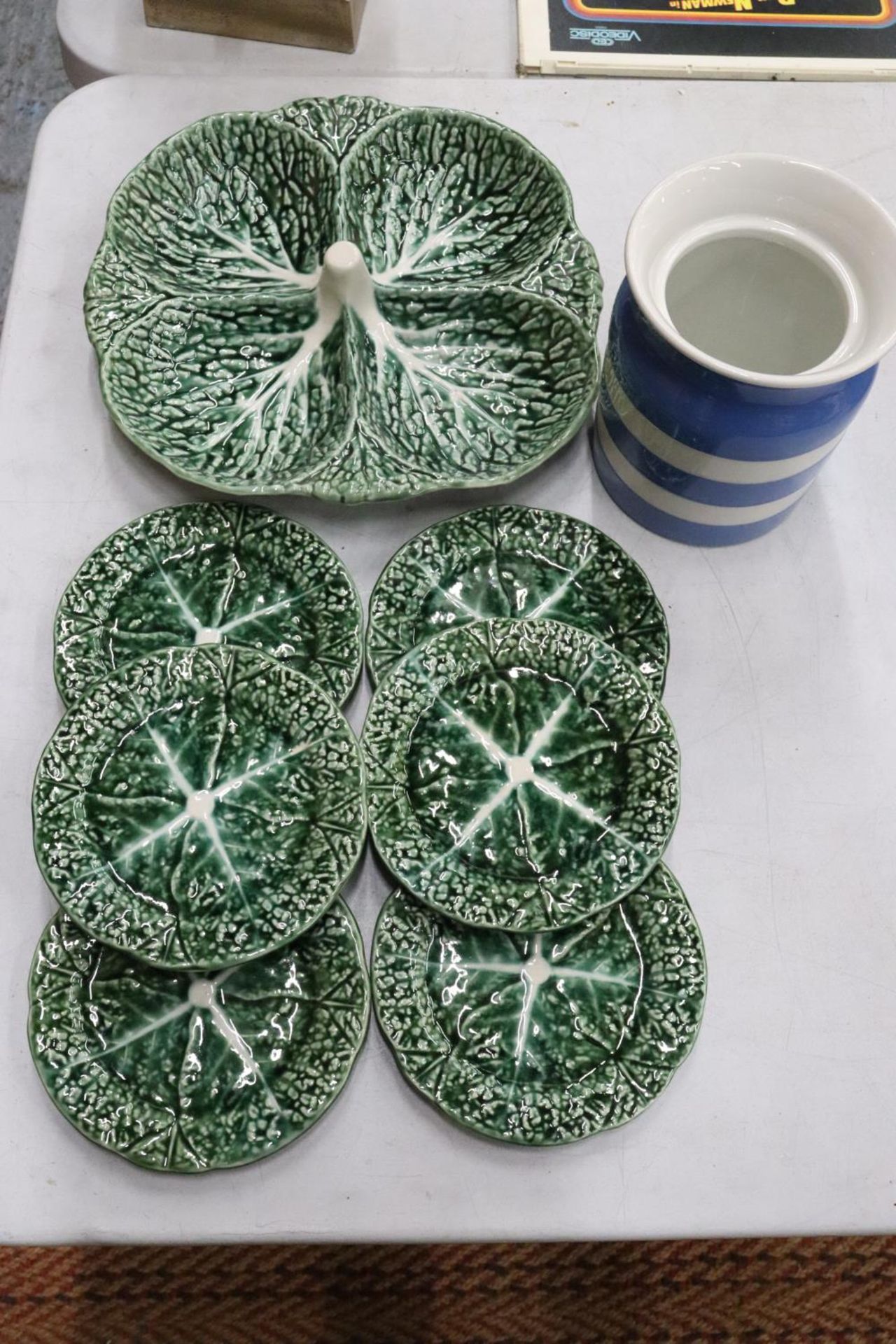 A T G GREEN CORNISH WARE JAR AND A PORTUGUESE SECTIONED HORS D'OEUVRES DISH WITH SIX SIDE PLATES