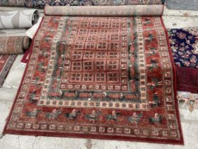 A RED PATTERNED RUG DEPICTING VARIOUS ANIMALS