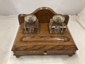 A DESK SET WITH LOWER DRAWER AND TWO ORIGINAL GLASS BOTTLES