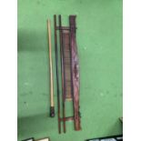 A VINTAGE WOODEN WEAVING IMPLEMENT PLUS A WALKING STICK WITH A WEIGHTED TOP