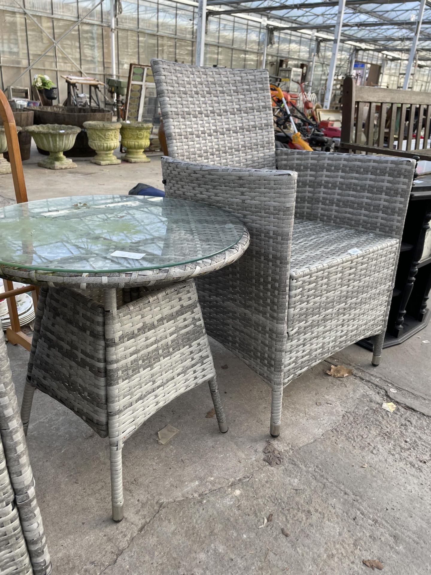 A RATTAN PATIO SET COMPRISING OF TWO CHAIRS AND A ROUND SIDE TABLE - Image 2 of 2