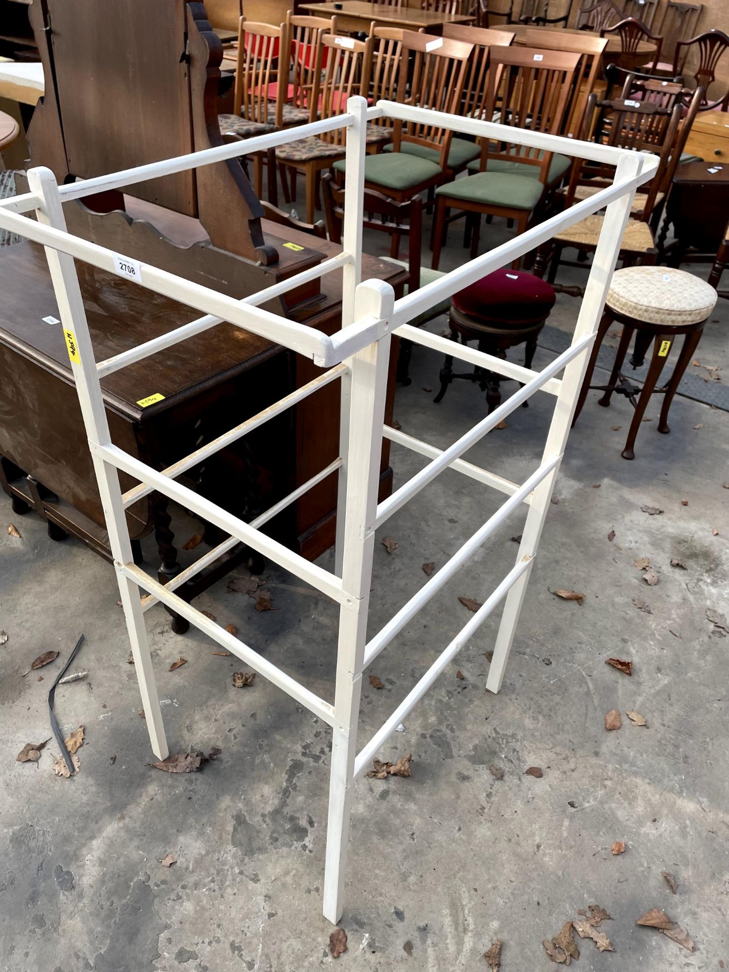 A FOURTEEN BAR PAINTED FREE STANDING AIRER