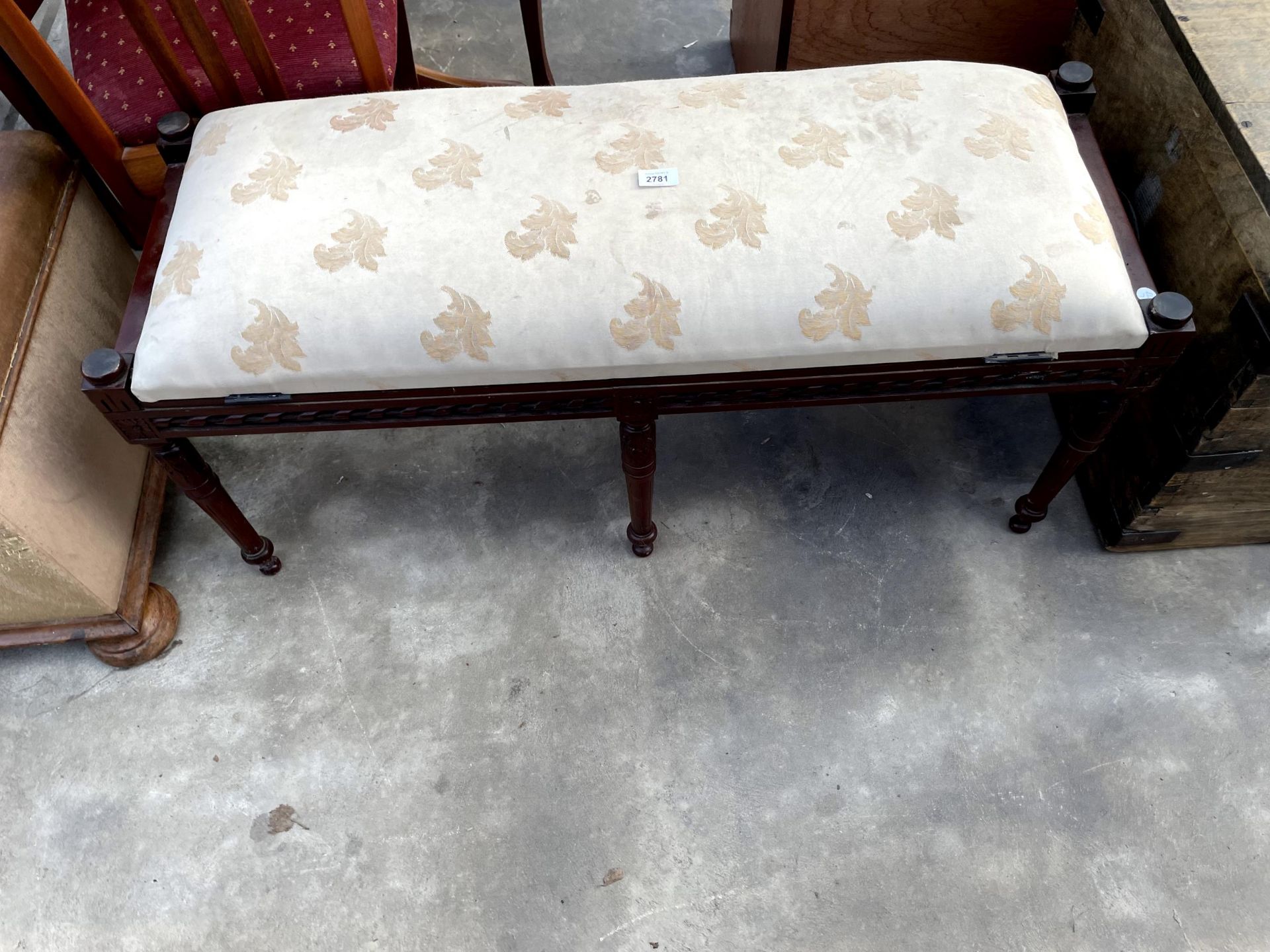 A MODERN DUET STOOL WITH LIFT-UP UPHOLSTERED TOP ON TURNED AND FLUTED LEGS