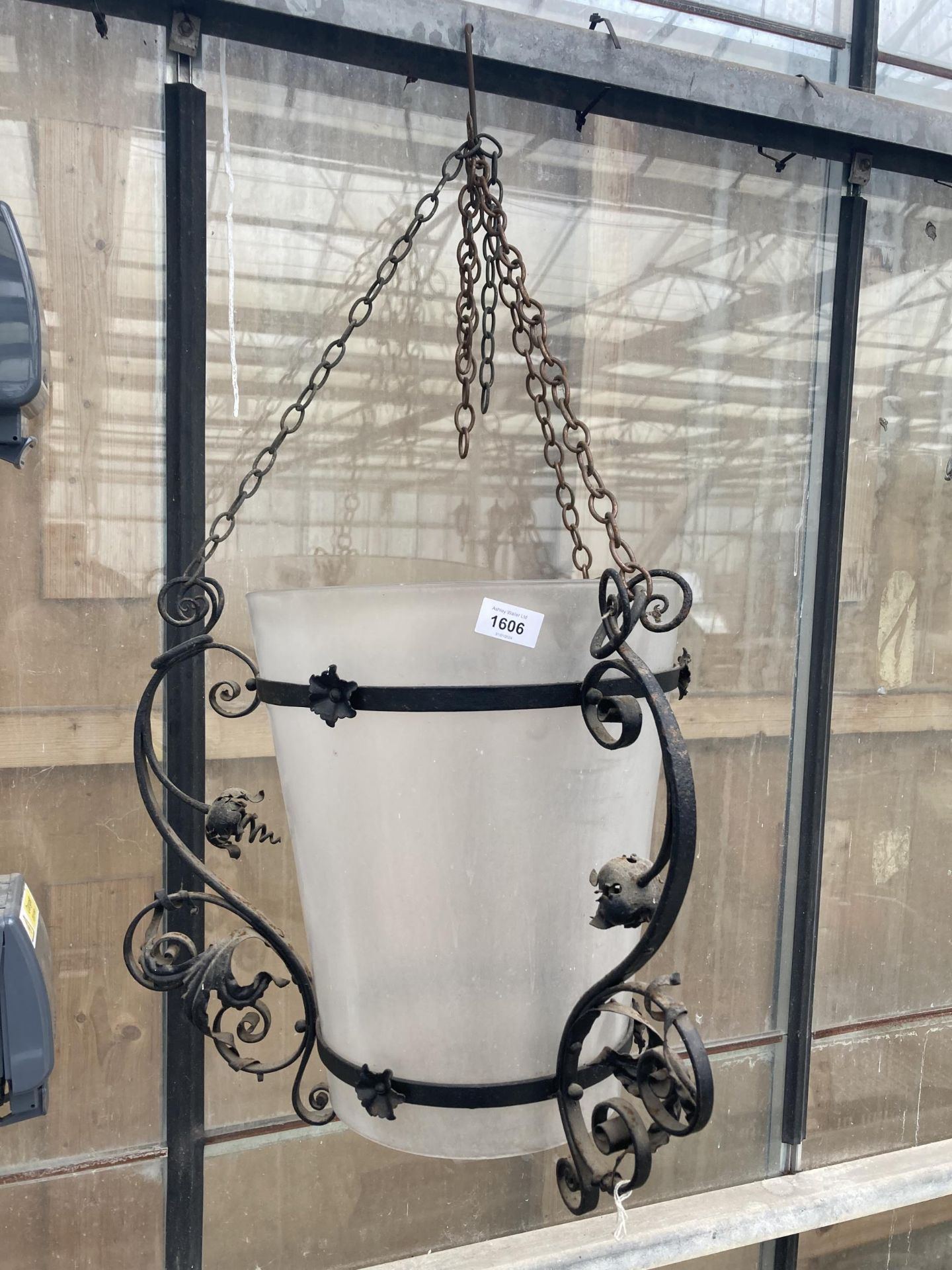 A LARGE VINTAGE FROSTED GLASS LIGHT SHADE WITH METAL DETAIL AND HANGING CHAINS