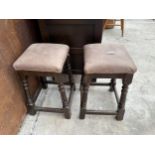 A PAIR OF BEECH FRAMED STOOLS AND TURNED LEGS