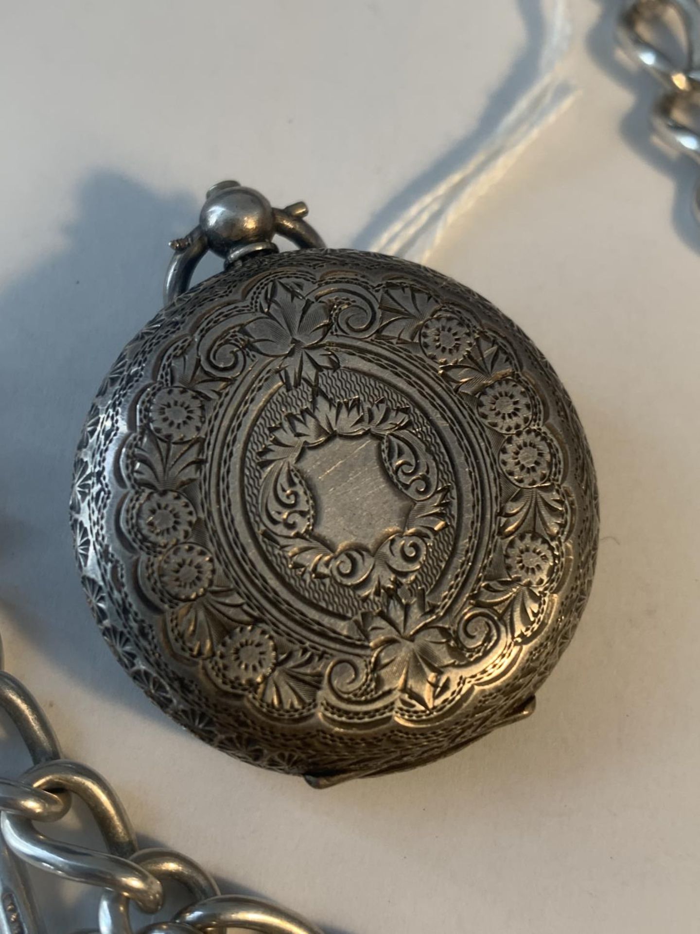 A MARKED 935 SILVER LADIES POCKET WATCH WITH DECORATIVE FACE AND CASE WITH A MARKED T BAR CHAIN - Image 3 of 6