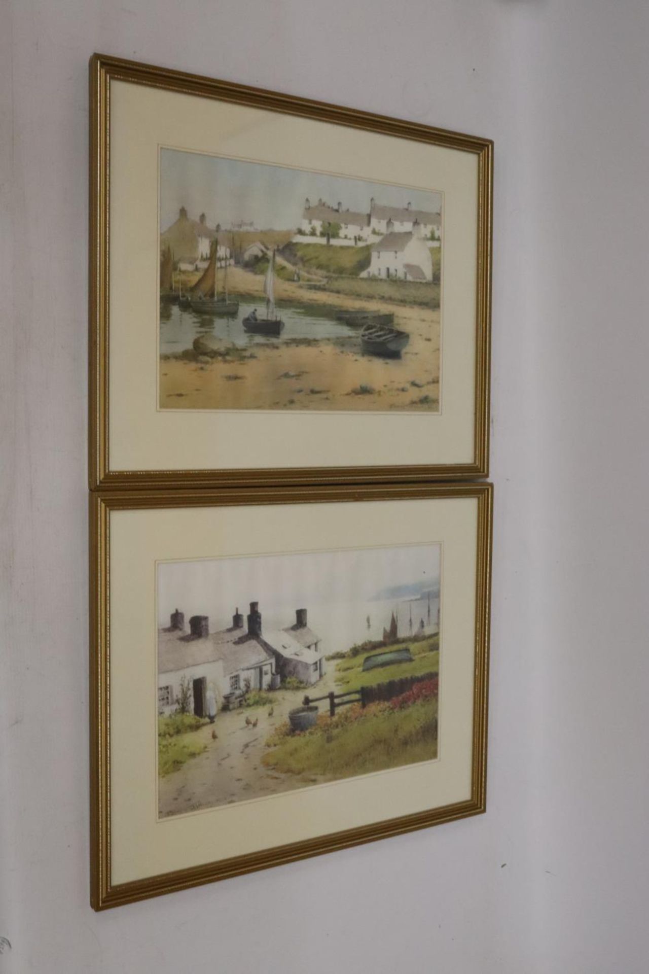 TWO FRAMED PRINTS BY WARREN WILLIAMS, 'FISHERMEN'S COTTAGES', MOELFRE, ANGLESEY AND 'PENRHYN',