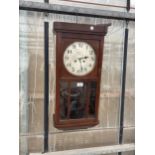 A VINTAGE MAHOGANY CASED CHIMING WALL CLOCK