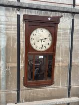 A VINTAGE MAHOGANY CASED CHIMING WALL CLOCK