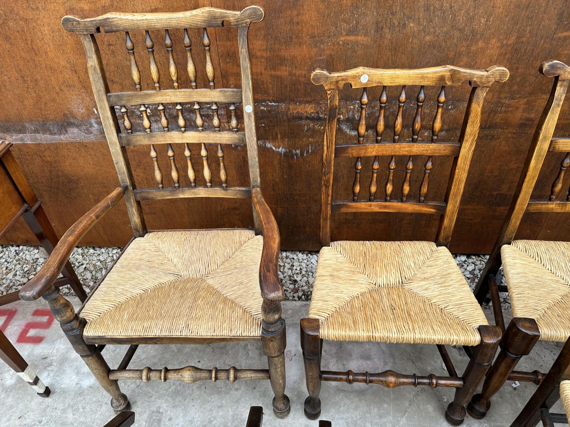 A SET OF EIGHT ELM AND BEECH LANCASHIRE SPINDLE BACK DINING CHAIRS, TWO BEING CARVERS, WITH RUSH - Image 5 of 5