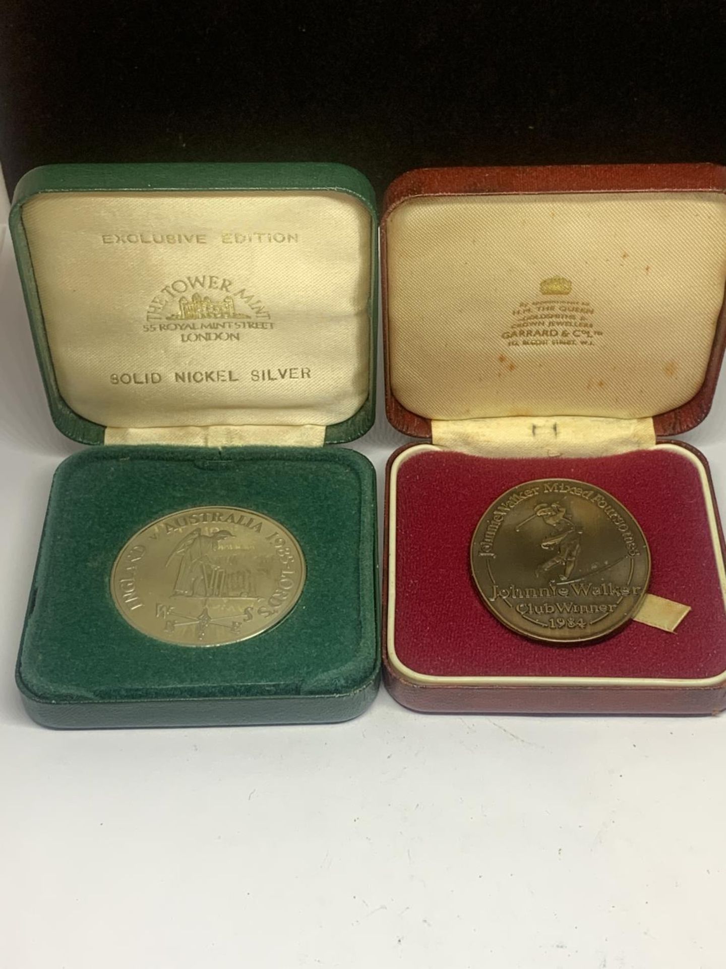 TWO BOXED MEDALS ONE LORDS 1985 AND ONE 1984 JOHNNIE WALKER CLUB WINNER