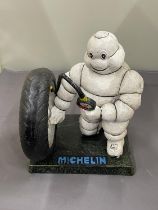 A CAST MICHELIN MAN FIGURE