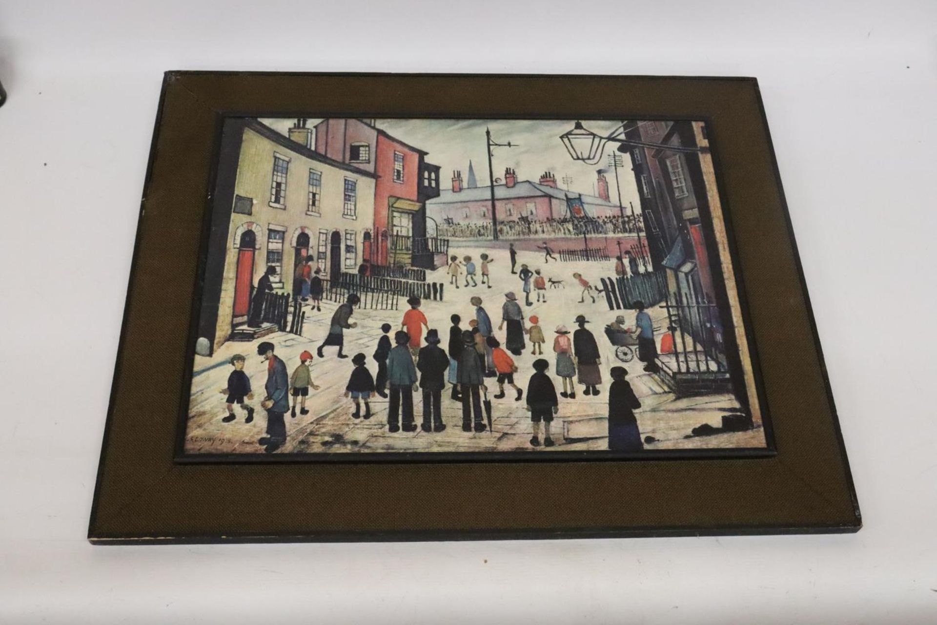 A LOWRY PRINT ON BOARD 'THE PROCESSION', 77CM X 62CM