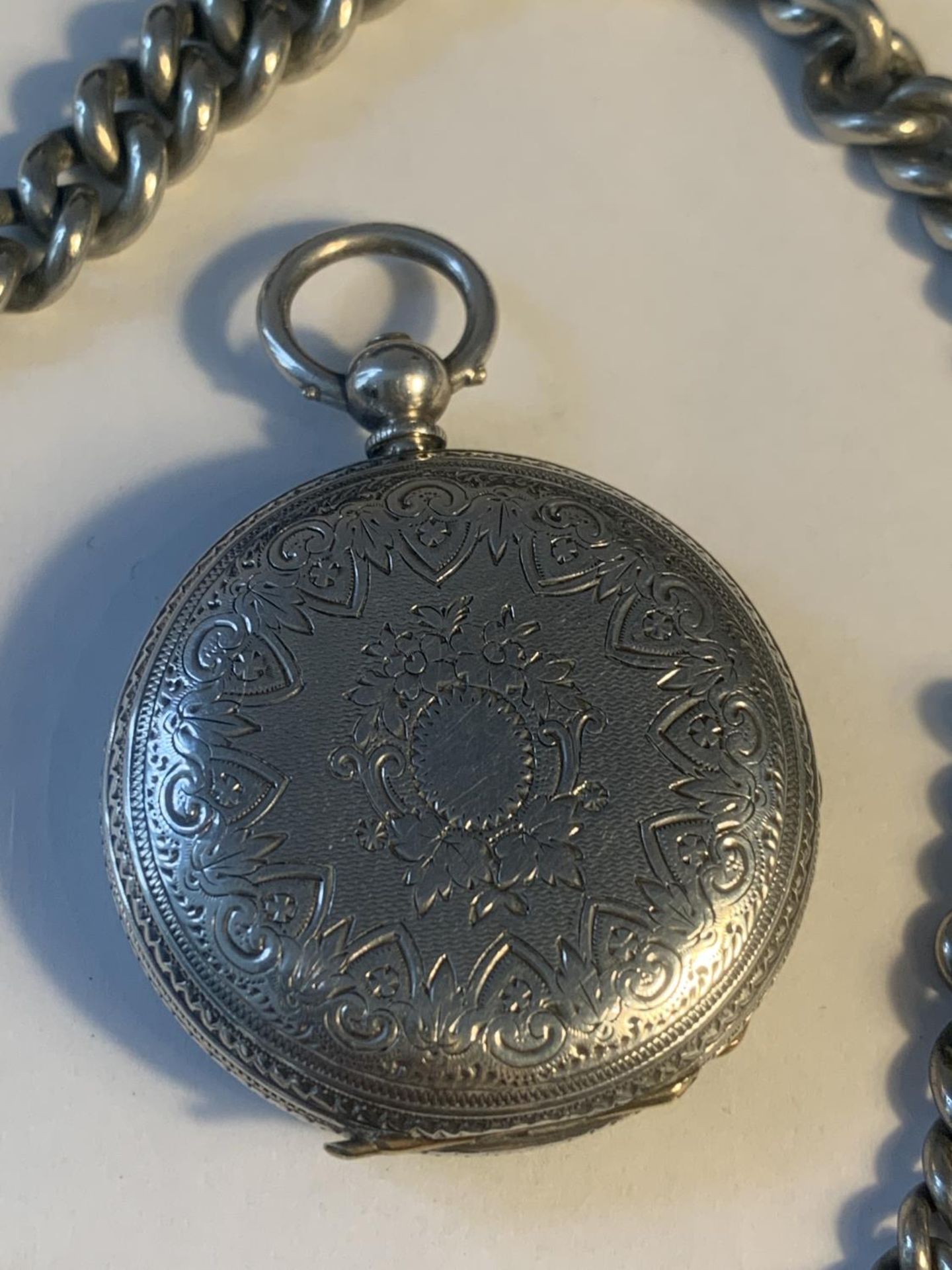 A MARKED FINE SILVER POCKET WATCH WITH DECORATIVE FACE AND A CHAIN - Image 3 of 6