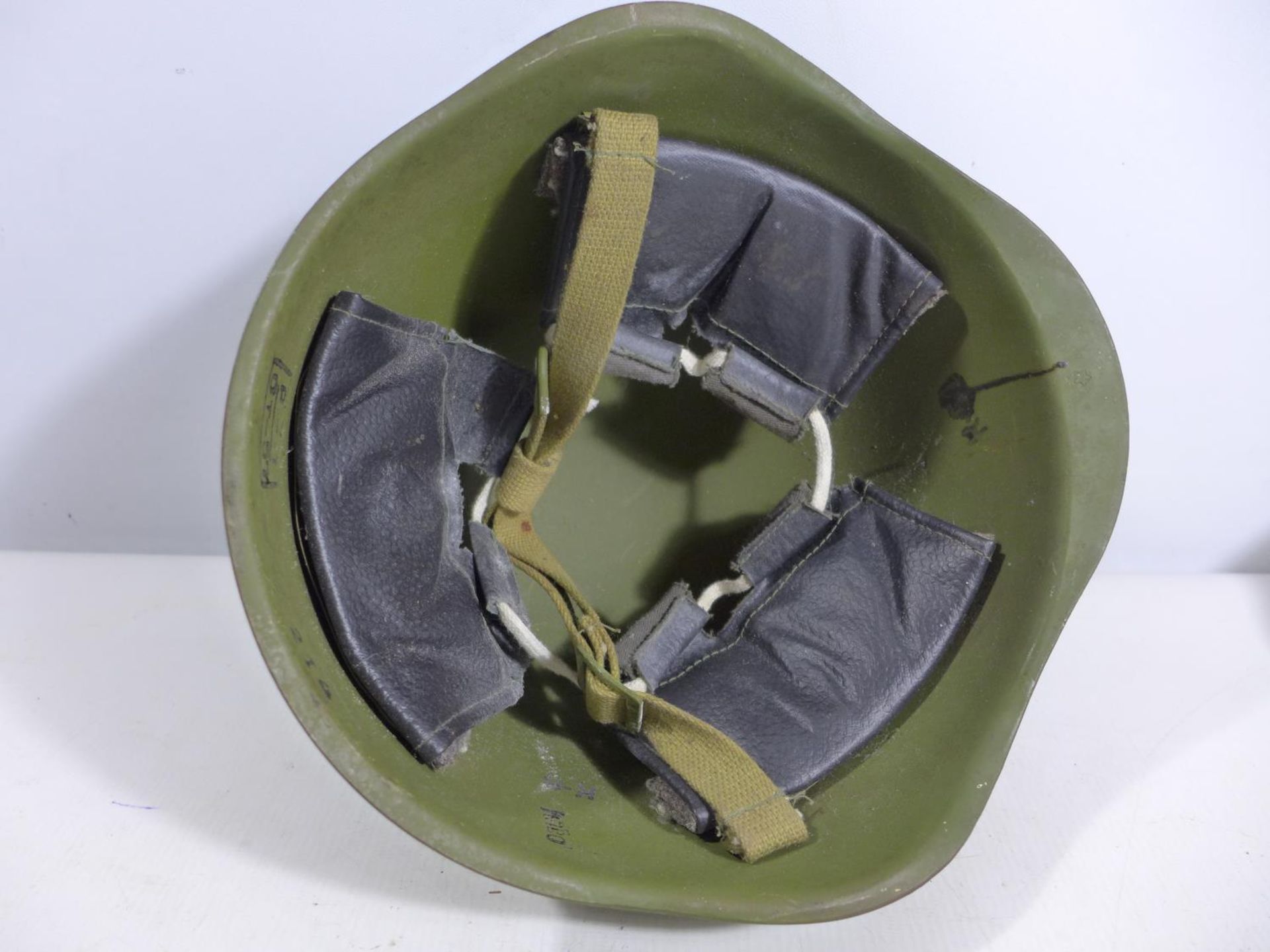 A GREEN PAINTED METAL MILITARY HELMET AND LINING - Image 3 of 5
