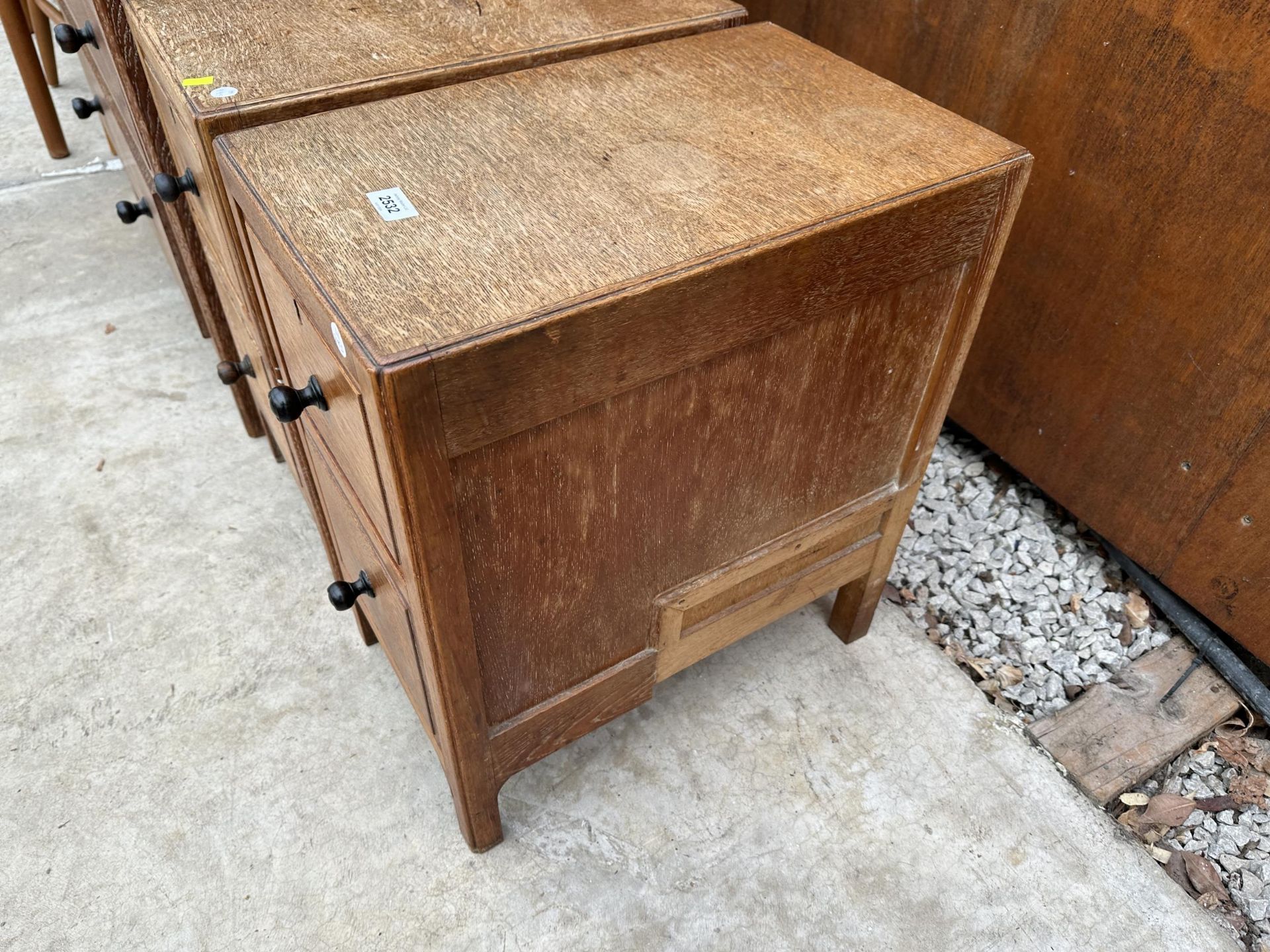 A PAIR OF HEAL AND SON (LONDON) LIMED OAK TWO DRAWER BEDSIDE CHEST WITH EBONISED KNOBS, PLEASE - Image 4 of 5