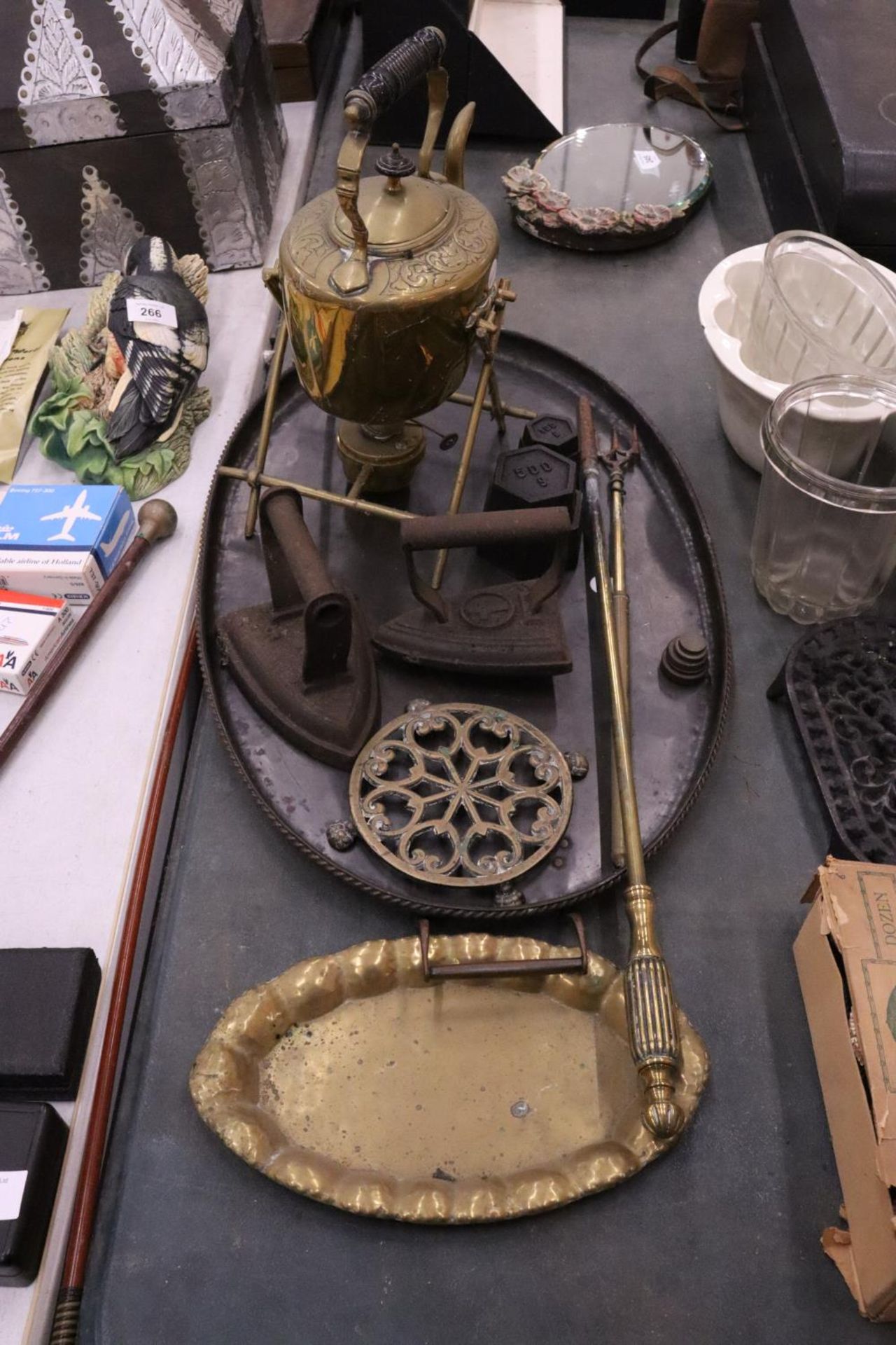 A VINTAGE LOT TO INCLUDE A LARGE METAL TRAY, A BRASS SPIRIT KETTLE AND BURNER, FLAT IRONS,