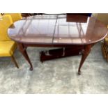 A MAHOGANY EXTENDING DINING TABLE ON CABRIOLE LEGS