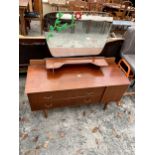 A RETRO TEAK DRESSING TABLE ENCLOSING TWO DRAWERS AND ONE CUPBOARD 46" WIDE