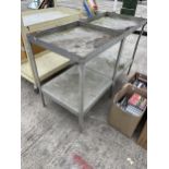 A PAIR OF METAL TWO TIER WORK TABLES