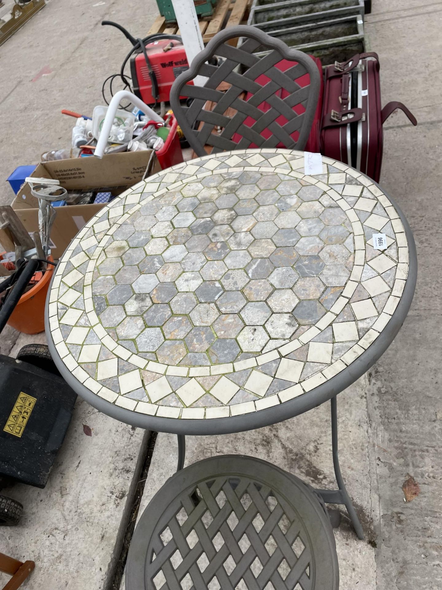 A METAL BISTRO SET COMPRISNG OF TWO CHAIRS AND A TILE TOP TABLE - Image 3 of 3