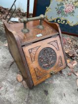 A VICTORIAN OAK COAL BUT WITH CARVED DOOR AND GALVANISED LINER