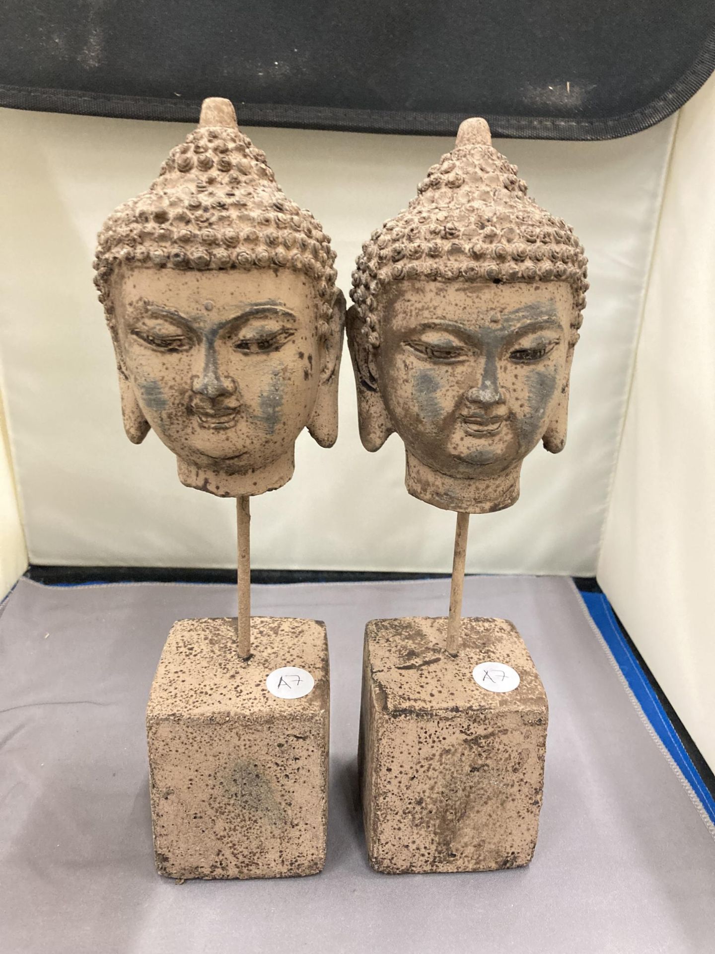 A PAIR OF STONE BUDDHA HEADS