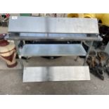 A STAINLESS STEEL TWO TIER WHEELED TROLLEY UNIT AND TWO STAINLESS STEEL SHELVES