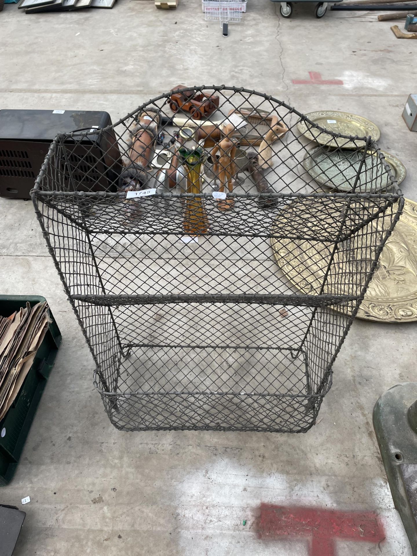 A THREE TIER WIRE MESH DISPLAY STAND