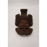 AN ASIAN STYLE CARVED WOODEN MASK