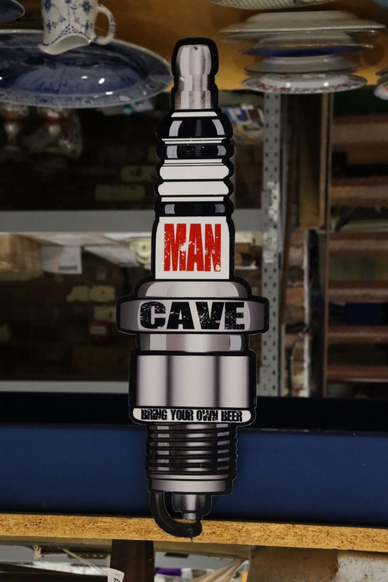 A MAN CAVE SPARK PLUG SIGN