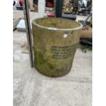 A SMALL CONCRETE PLANTER WITH INDESTINCT WRITING