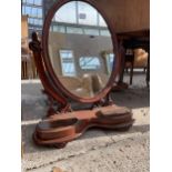 A VICTORIAN MAHOGANY OVAL SWING FRAME DRESSING MIRROR WITH TWO JEWELLERY COMPARTMENTS