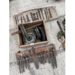 AN ASSORTMENT OF VINTAGE TOOLS TO INCLUDE PULLEY WHEELS, AND STONE MASONS CHISELS ETC