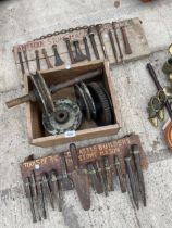 AN ASSORTMENT OF VINTAGE TOOLS TO INCLUDE PULLEY WHEELS, AND STONE MASONS CHISELS ETC