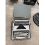 A RETRO OLYMPIA TYPEWRITER WITH CARRY CASE