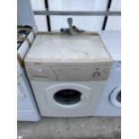 A CREAM HOTPOINT WASHING MACHINE