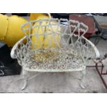A VINTAGE WHITE PAINTED METAL TWO SEATER GARDEN BENCH