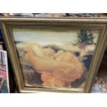 A FRAMED PRINT OF A LADY RELAXING IN AN ORNAGE DRESS (GLASS A/F)