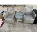 A RATTAN PATIO SET COMPRISING OF TWO CHAIRS AND A ROUND SIDE TABLE