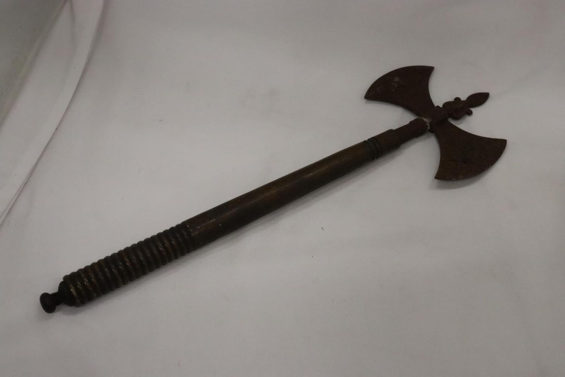 A VINTAGE DOUBLE HEADED GRYPHON AXE