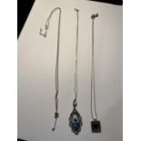 THREE SILVER NECKLACES WITH PENDANTS