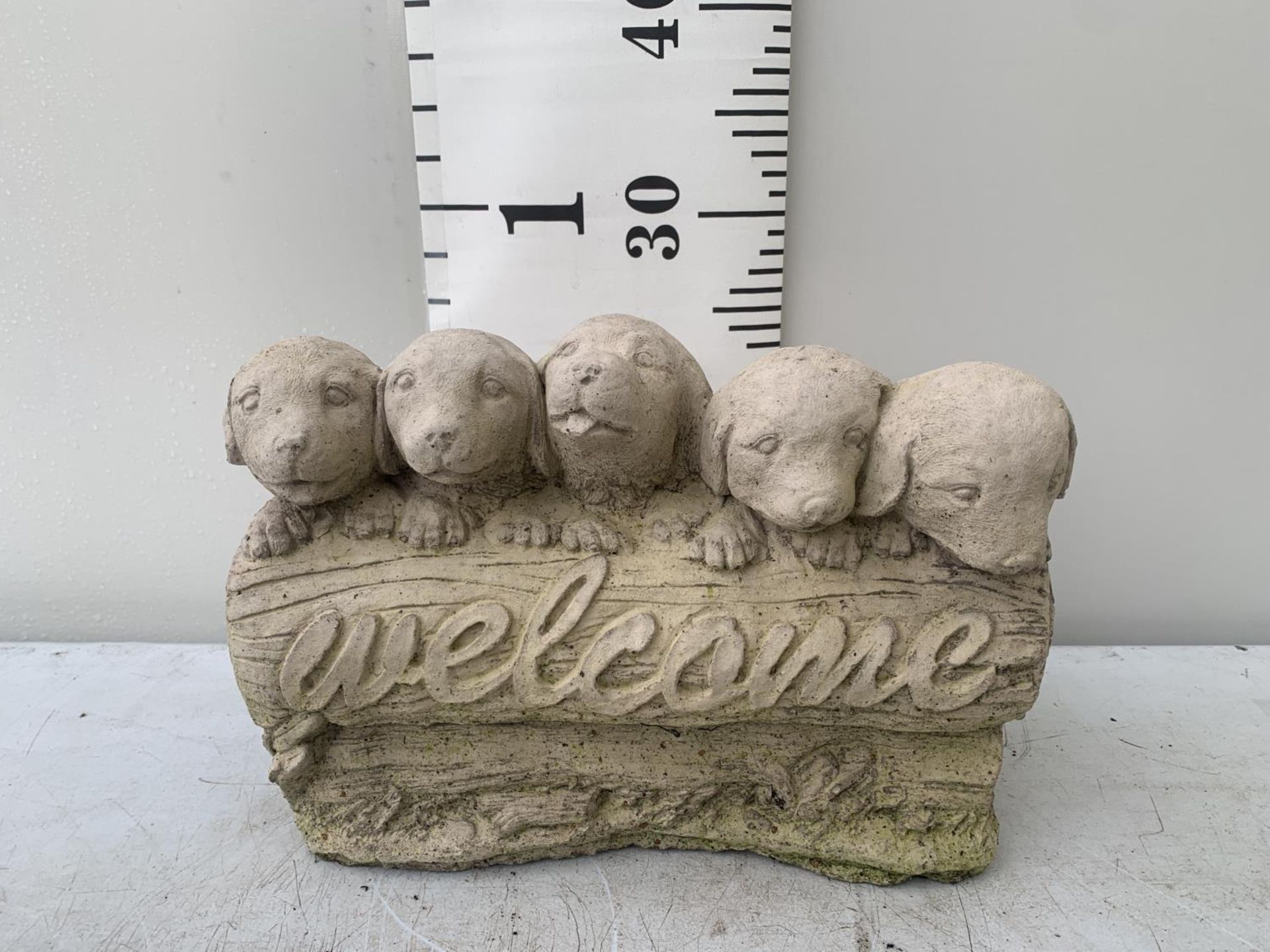 A CONCRETE WELCOME DOGS ORNAMENT NO VAT