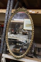 A GILT FRAMED OVAL MIRROR, 44CM X 75CM