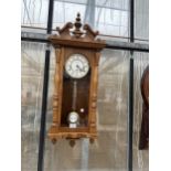 AN OAK CASED WESTMINISTER CHIMING WALL CLOCK