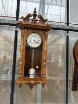 AN OAK CASED WESTMINISTER CHIMING WALL CLOCK