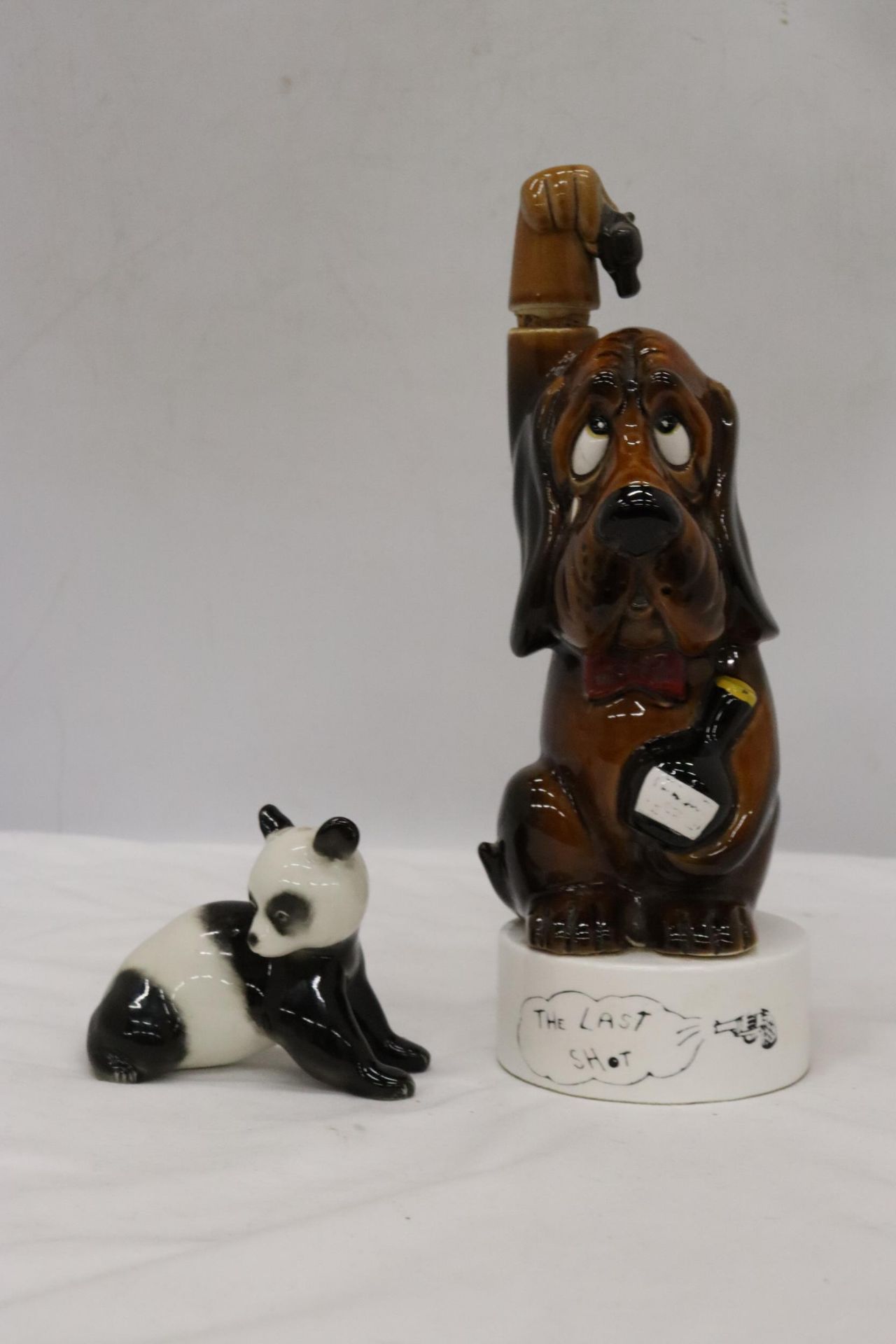 A LOMONOSOV PANDA AND 'THE LAST SHOT' DOG FIGURINE